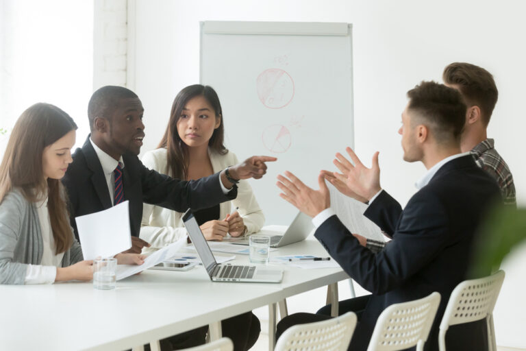 African worker disputing disagreeing with caucasian colleague du