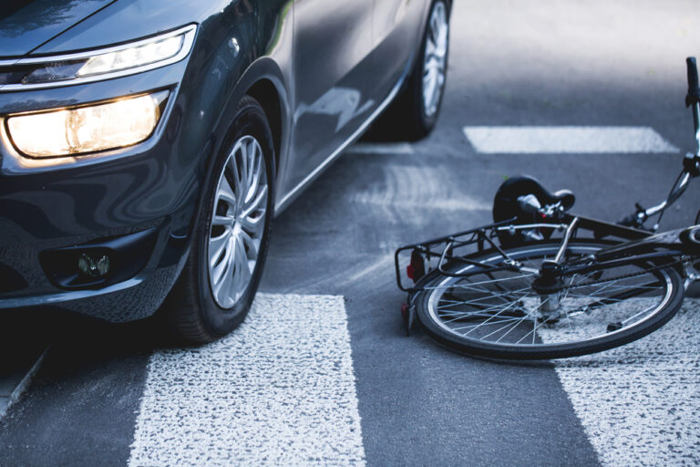 Car,Standing,On,The,Pedestrian,Path,With,The,Downed,Bicycle